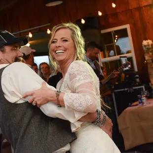 a bride and groom dancing at their wedding reception