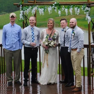 a bride and groom with their wedding party