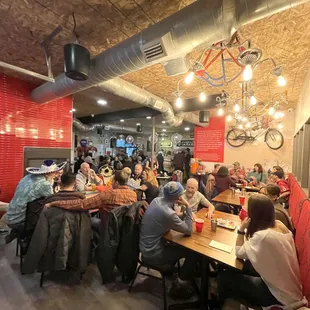 a large group of people sitting at tables