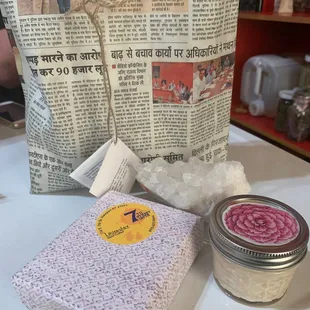 A gift bag, Bamboo Teak(far right), Courts Crystal(in front of bag), and Lavender(in the box).