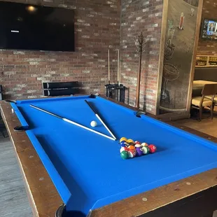a pool table with billiards on it