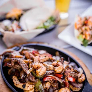 Combo Fajitas served on a sizzling cast iron pan