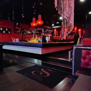 a pool table and a bar