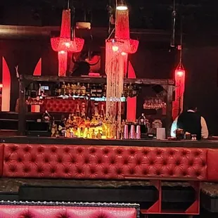 a red couch and bar