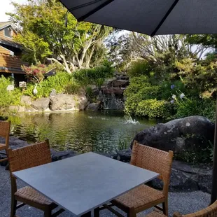 Outdoor seating with lovely koi pond. Enjoy the sounds of water and chirping birds in the morning.
