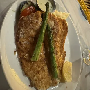 Almond Crusted Rainbow Trout...WOW!  8 oz. fillet pan seared, swapped the crispy garlic potato wedges for mashers. Stunning AND delish!