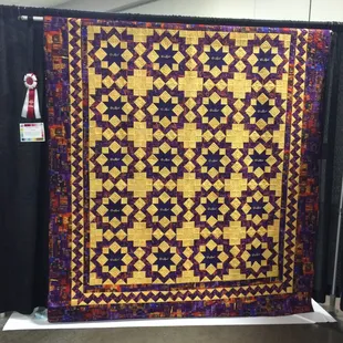 Quilt of Crown Royal Bags in a carptenters Wheel block