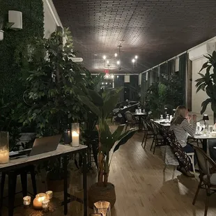 people sitting at tables in a restaurant