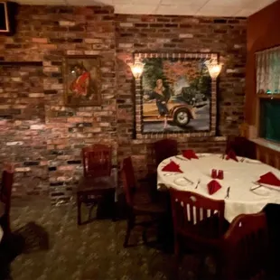 a dining room with brick walls
