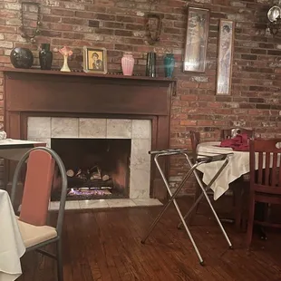 a dining room with a fireplace