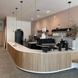 Love the wood paneling and the soft pink hue of the walls - it's a relaxing vibe