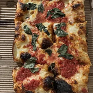 Cheese pizza with basil