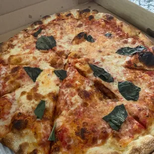 Cheese pizza with basil