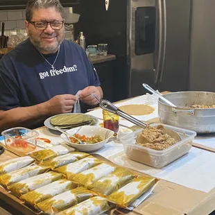 This chef Jaime Acevedo making Pasteles for a customer