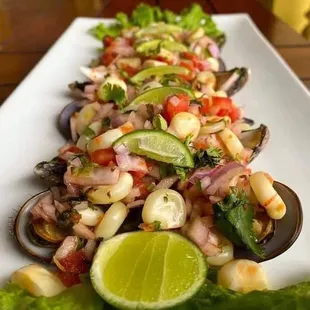 Chorito a la chalaca ( mussels a la chalaca marinated in lemon juice and Peruvian chili peppers )