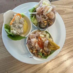 Trío marino (marine trio, classic ceviche, mixed ceviche and marine cause in crab pulp)