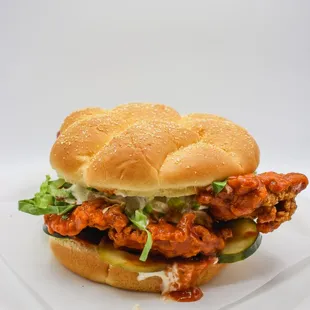 a chicken sandwich on a white plate