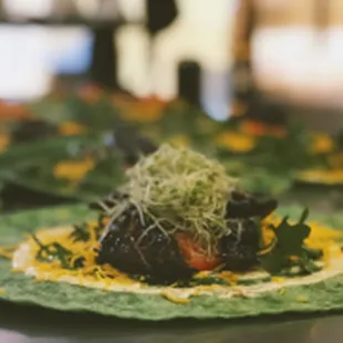 Spinach wrap filled with cheese, garlic aioli, arugula, tomatoes, portobello mushrooms, and jalapeno ranch