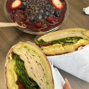 a sandwich and a bowl of fruit