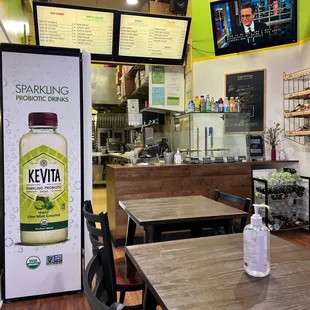a bottle of kevia sitting on a table in a restaurant