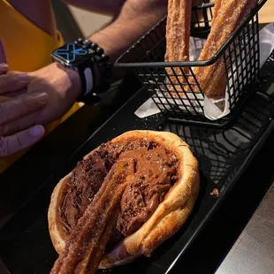 a pastry and a sandwich on a tray