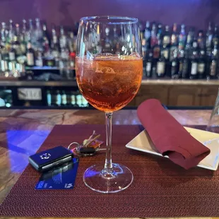 a glass of rose wine and car keys