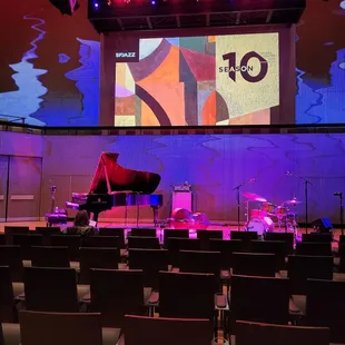 a stage with a grand piano