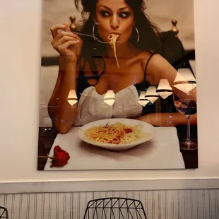 a woman eating spaghetti
