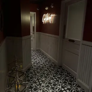 Hallway to bathroom - sign says &quot;good kiss spot&quot;