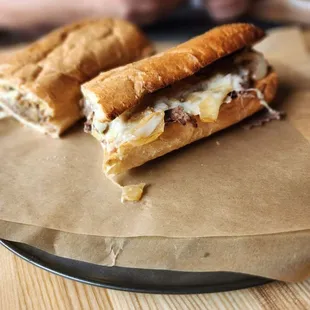two sandwiches on a plate on a table