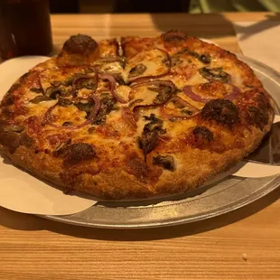 Traditional pizza with mushrooms and onions