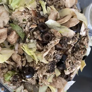 a salad with mushrooms and lettuce