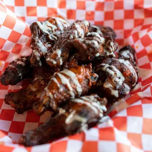 Baked to a crisp perfection. Available in buffalo, barbecue, or honey sriracha sauces.