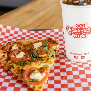 Our Margherita Pizza: Fresh mozzarella, Roma tomatoes, basil, and garlic.