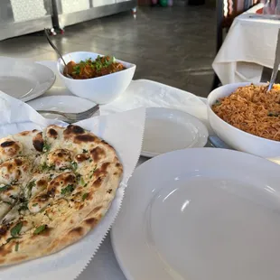 Garlic naan, chicken fried rice, and chicken vindaloo