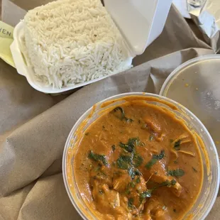 a bowl of curry and a plate of rice