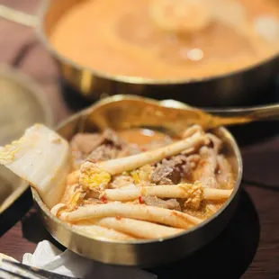 Cooked in broth mushrooms and meat