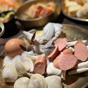 Clams hot dog I and some blue sea-rab and I boiled that egg had it with rice and soy sauce if know u know lol