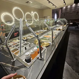 Self-serve seafood, veggies, sauce, rice, and sides bar