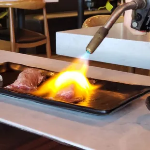 Blown torches right at your table!