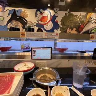 Tonkatsu broth and conveyor belt