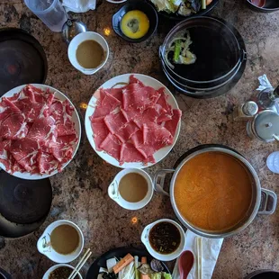 Sukiyaki (brown) and spicy miso (orange) with the new York beef and ribeye