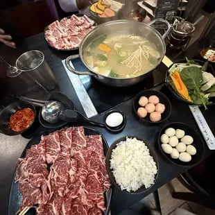 In the photo: miso soup, toro beef belly, and kobe beef