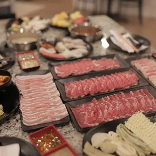 a variety of meats on a table