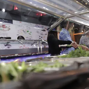 a group of people preparing food