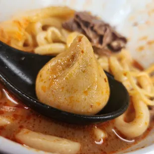 a bowl of soup with a spoon