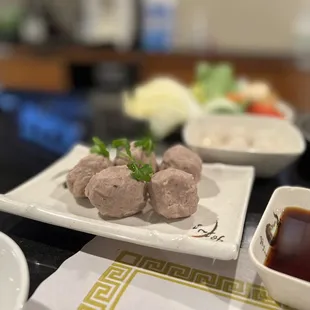 a plate of meatballs on a table