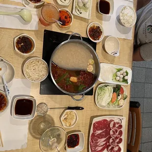 Hot pot (tonkutsu on the top, spicy szechuan on bottom)