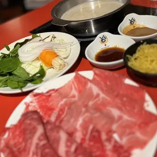 a plate of meat and vegetables