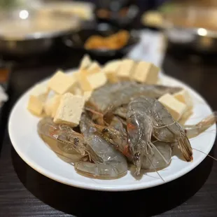 a plate of shrimp and rice